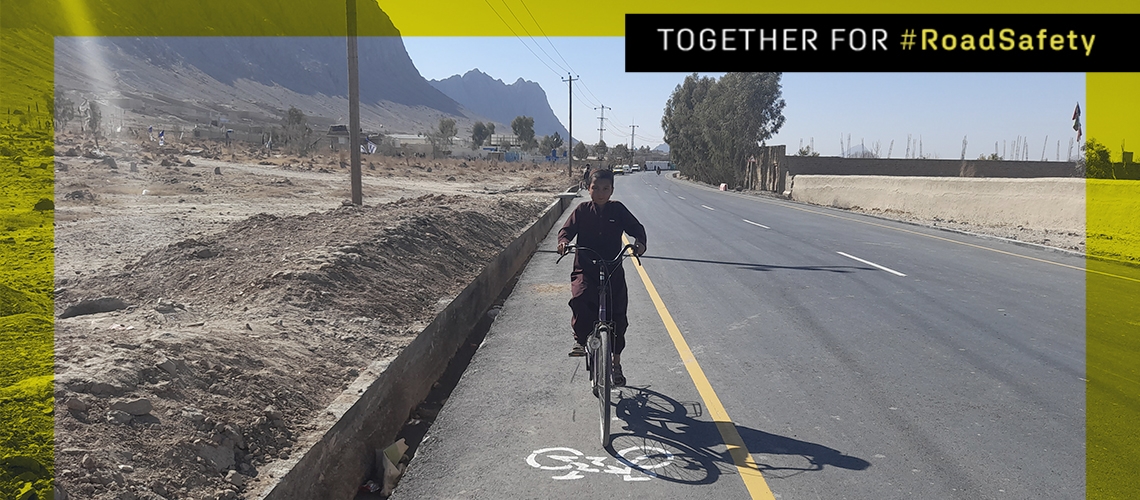 A resident of Kandahar city commuting to school using the new bike lanes built with support from Cities Investment Program